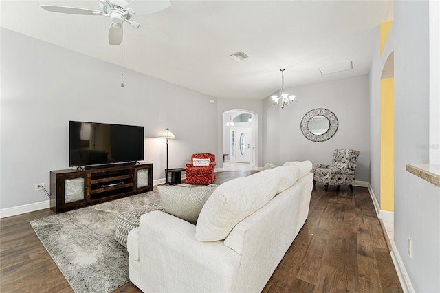 living room with ceiling fan and dark wood-type flooring