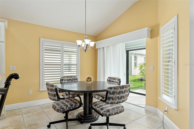 dining space with vaulted ceiling, a chandelier, and light tile patterned floors