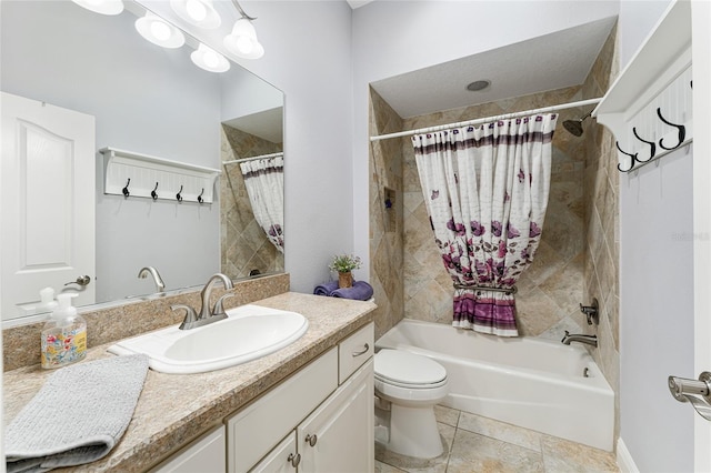 full bathroom featuring vanity, shower / bath combo with shower curtain, toilet, and tile patterned floors