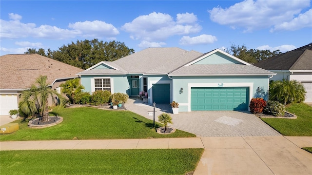 ranch-style home featuring a garage and a front yard