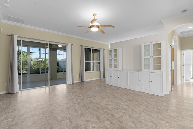 spare room featuring ceiling fan and crown molding