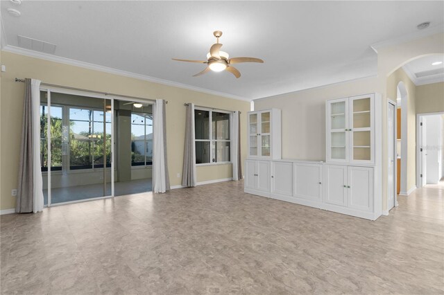25304 Forest Oak Ct, Leesburg, FL 34748 - unfurnished living room with a ceiling fan, tile patterned floors, arched walkways, baseboards, and ornamental molding