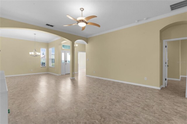 25304 Forest Oak Ct, Leesburg, FL 34748 - spare room featuring ceiling fan with notable chandelier, arched walkways, baseboards, ornamental molding, and visible vents