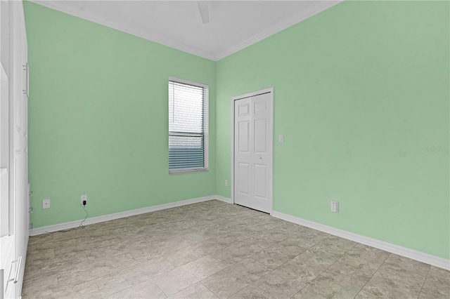 spare room featuring crown molding