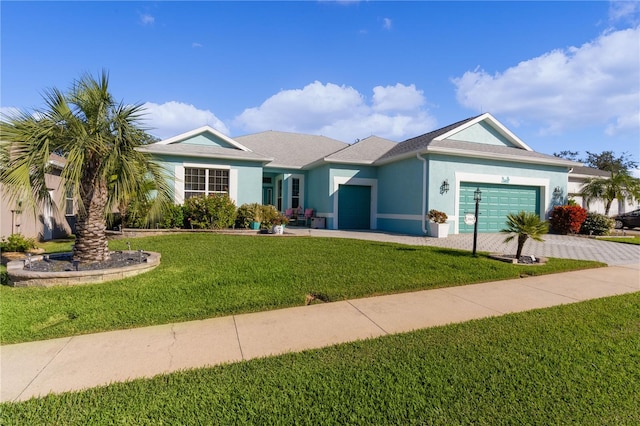 ranch-style home featuring a front lawn and a garage