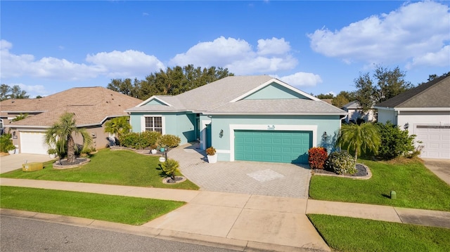 single story home with a front yard and a garage