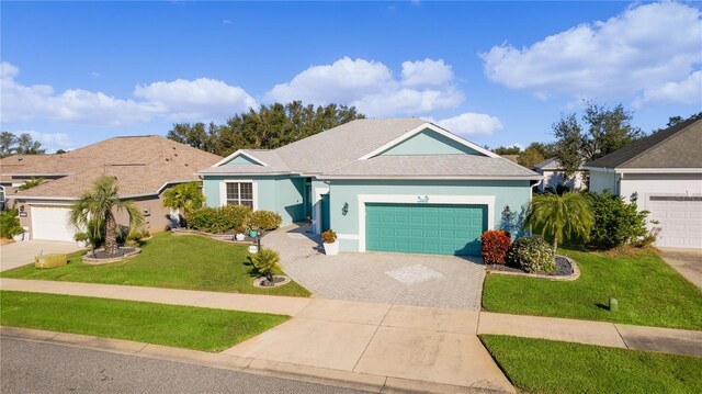 25304 Forest Oak Ct, Leesburg, FL 34748 - ranch-style home featuring a garage, driveway, a front yard, and stucco siding