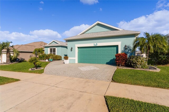 25304 Forest Oak Ct, Leesburg, FL 34748 - ranch-style house featuring stucco siding, an attached garage, a front yard, and decorative driveway