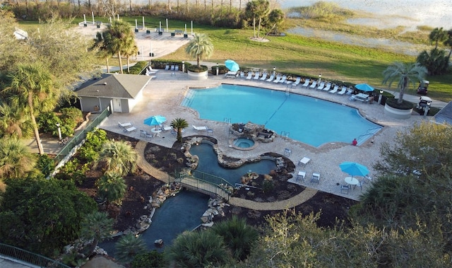 view of pool featuring a hot tub and a patio