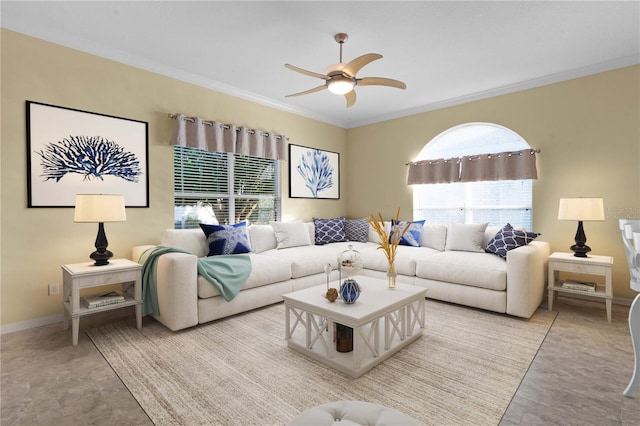 living room featuring ceiling fan and ornamental molding