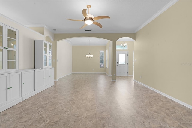 spare room with crown molding and ceiling fan with notable chandelier