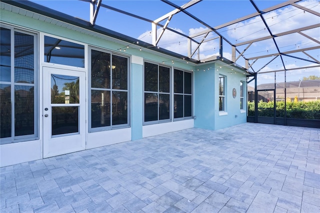 view of patio / terrace with a lanai