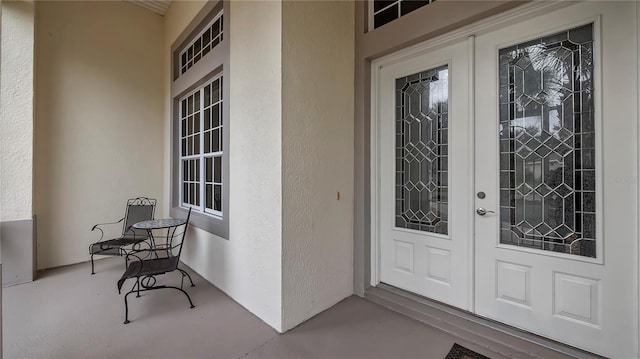 entrance to property featuring french doors