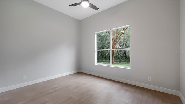 empty room featuring ceiling fan and light wood-type flooring