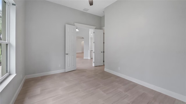 unfurnished bedroom with light hardwood / wood-style flooring and ceiling fan