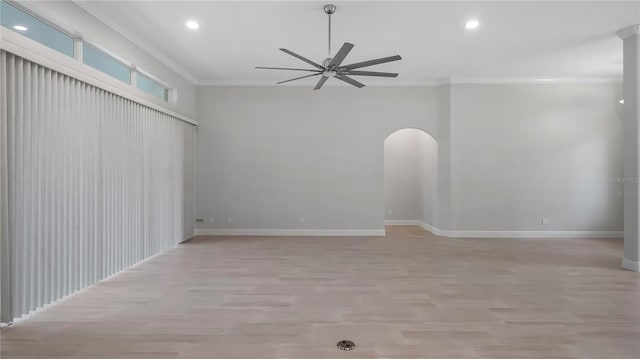 unfurnished room with ornamental molding, light hardwood / wood-style floors, and ceiling fan