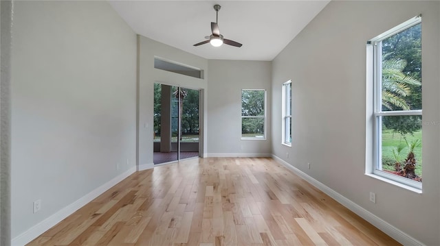 unfurnished room featuring ceiling fan, plenty of natural light, and light hardwood / wood-style floors