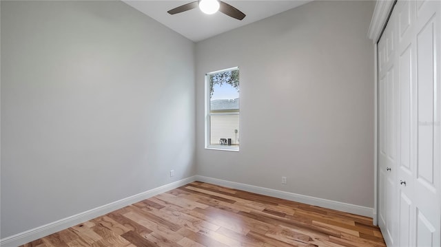 empty room featuring ceiling fan and light hardwood / wood-style flooring