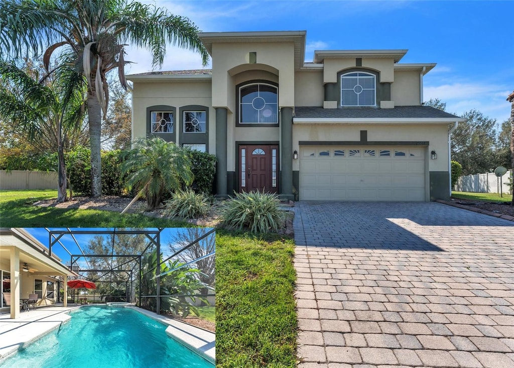 view of front facade with a fenced in pool, a garage, and glass enclosure