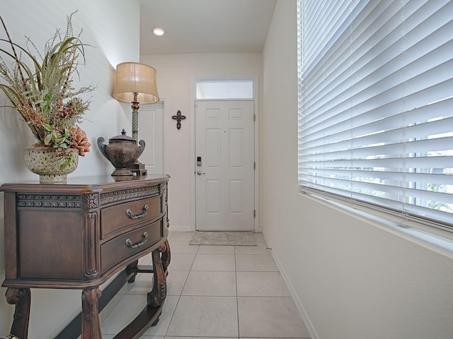 entryway with light tile patterned floors