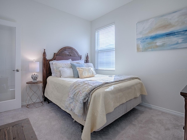 bedroom with light carpet