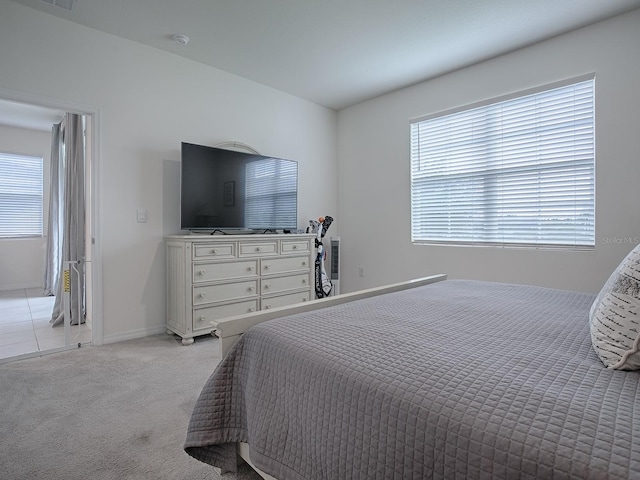 bedroom with light carpet