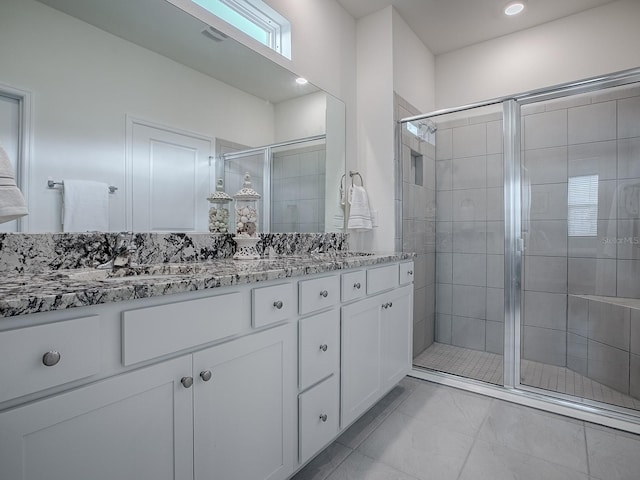 bathroom featuring vanity and walk in shower