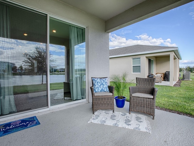 view of patio / terrace with a water view