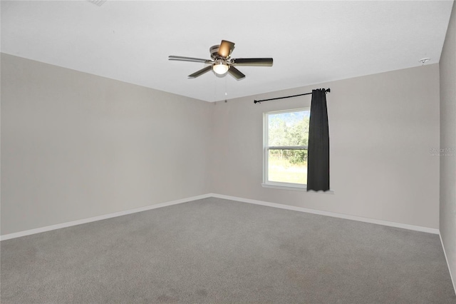 unfurnished room with ceiling fan and carpet floors