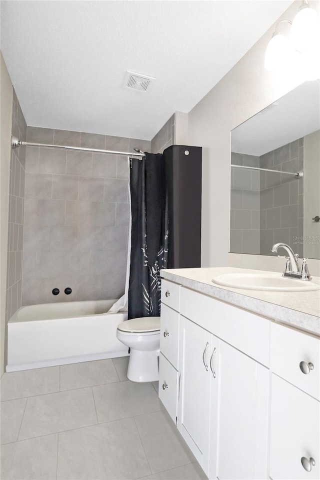 full bathroom with vanity, tile patterned flooring, toilet, and shower / tub combo