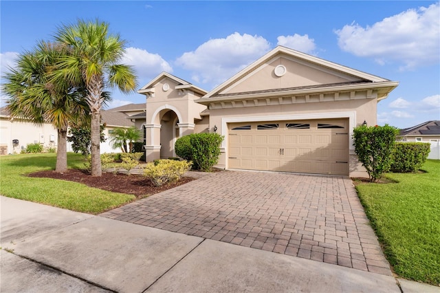 view of front facade featuring a front lawn and a garage