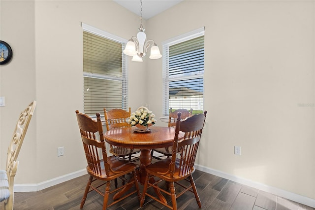 dining area featuring an inviting chandelier