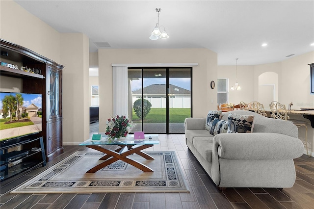 living room featuring a notable chandelier