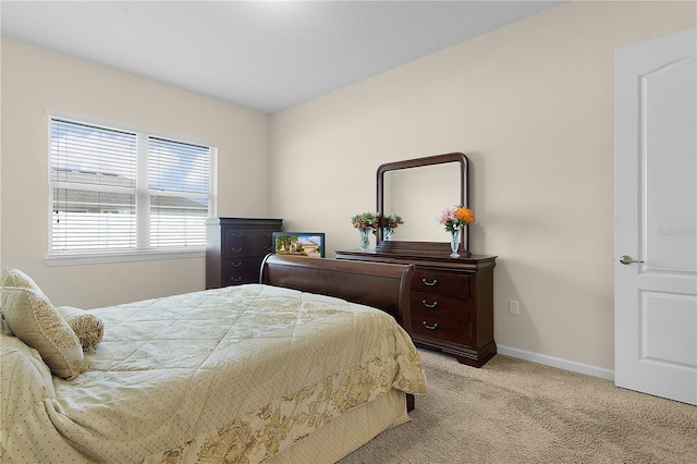 bedroom featuring light colored carpet