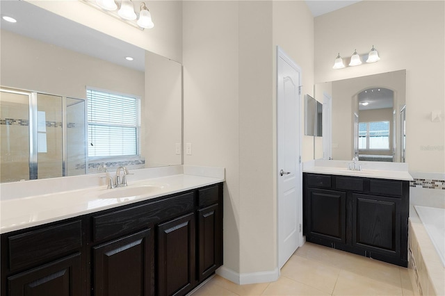 bathroom featuring tile patterned floors, plenty of natural light, vanity, and a shower with door