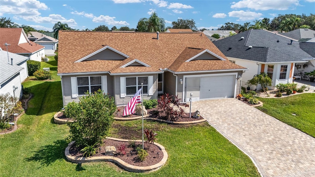 view of front facade featuring a front lawn and a garage