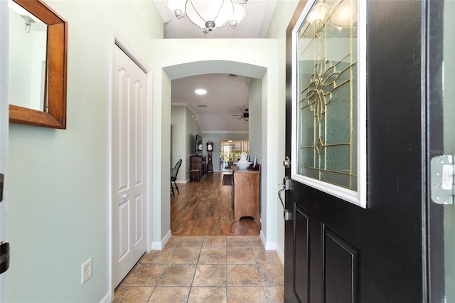 entryway with ceiling fan and light hardwood / wood-style floors