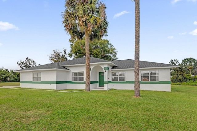 ranch-style home with a front lawn