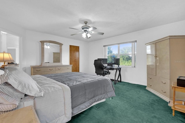 bedroom featuring ceiling fan and dark colored carpet