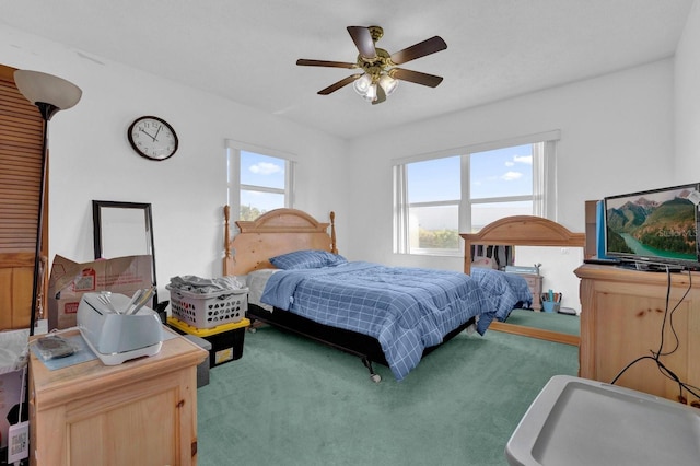 bedroom with ceiling fan and carpet