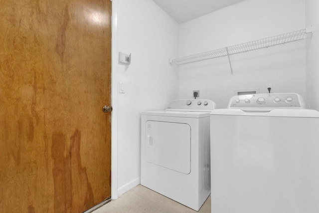 laundry room with independent washer and dryer