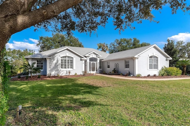 ranch-style home with a front lawn