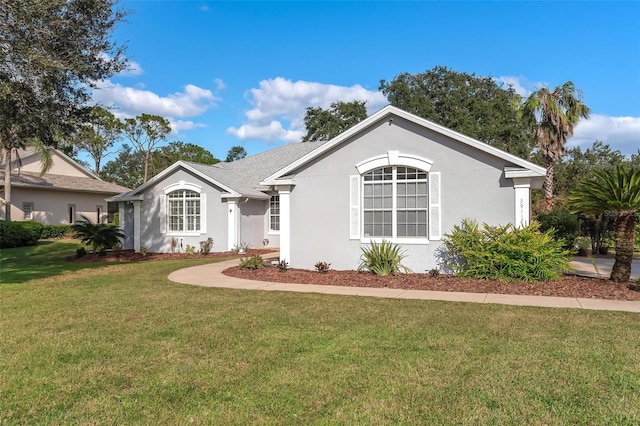 ranch-style house with a front lawn