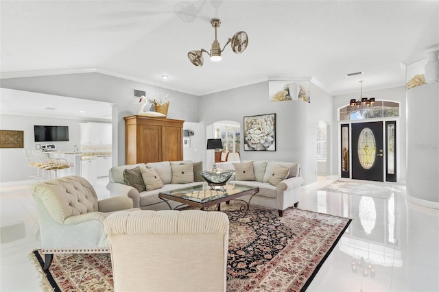 tiled living room with an inviting chandelier, lofted ceiling, and crown molding