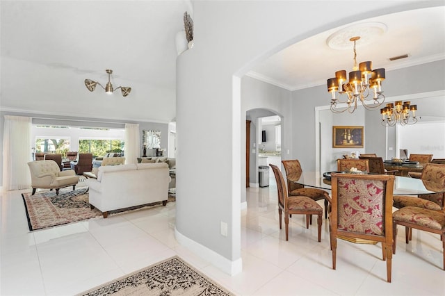 tiled dining room featuring a notable chandelier and ornamental molding