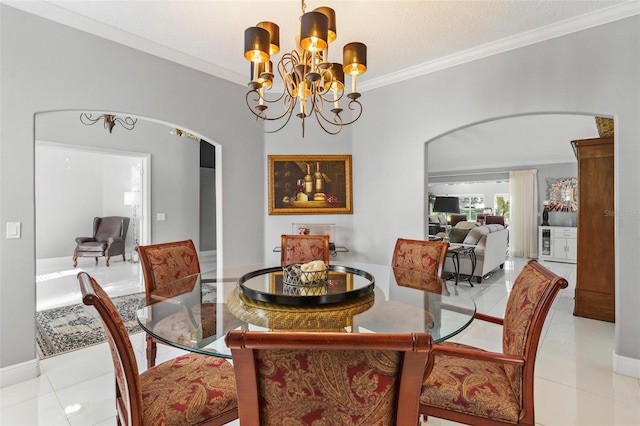 tiled dining space featuring ornamental molding and an inviting chandelier