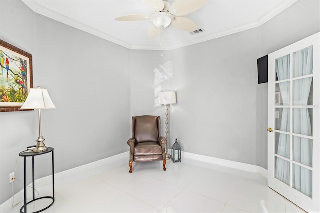 sitting room featuring crown molding, light tile patterned flooring, and ceiling fan