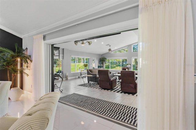 living room with tile patterned floors, ornamental molding, and vaulted ceiling