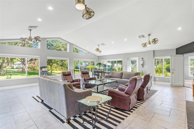 living room with light tile patterned flooring, lofted ceiling, and a wealth of natural light