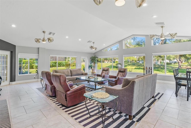 living room with ceiling fan, a healthy amount of sunlight, and light tile patterned flooring